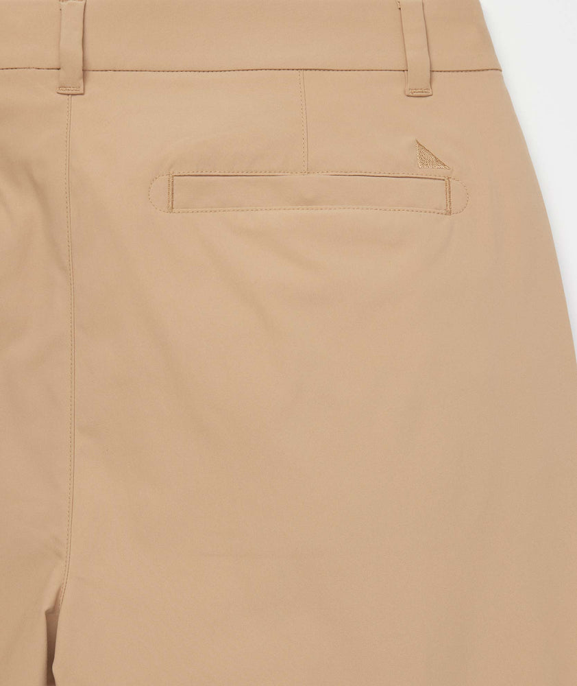 Model is wearing UNTUCKit Chancellor pants in khaki.
