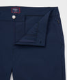 Model is wearing UNTUCKit Chancellor pants in navy.