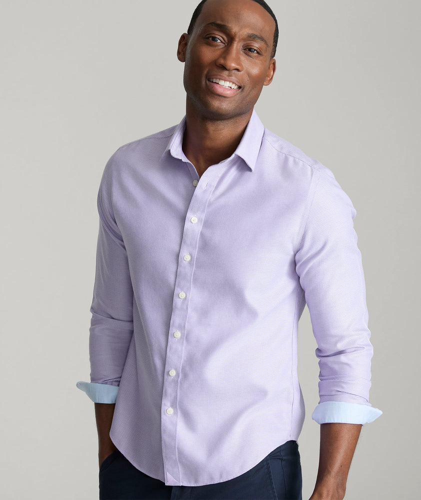 Model is wearing UNTUCKit Burke shirt in purple.