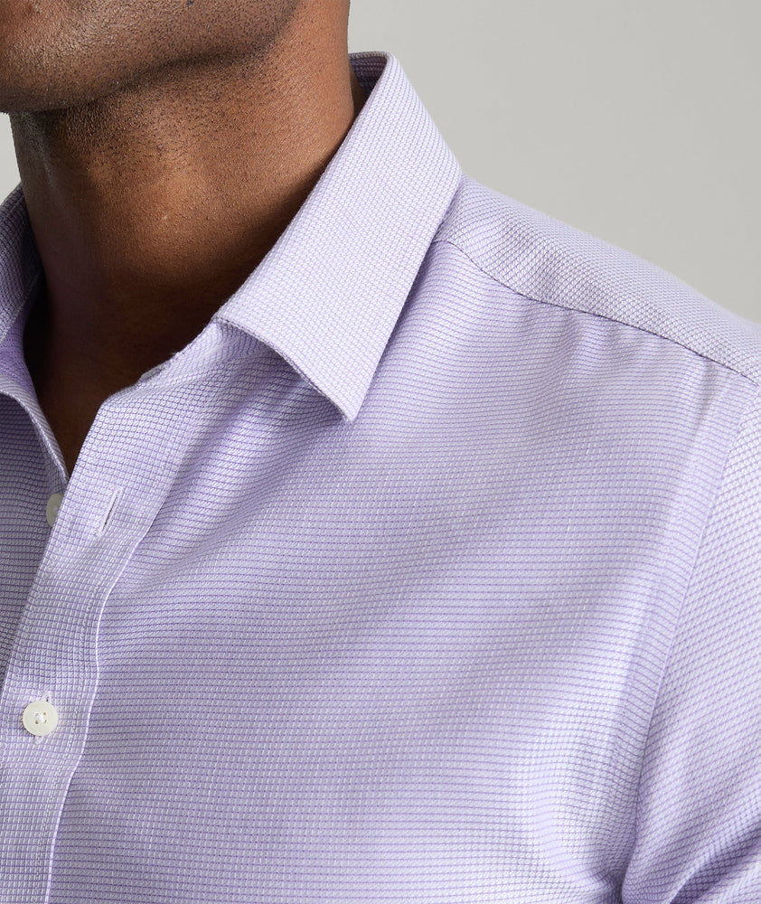 Model is wearing UNTUCKit Burke shirt in purple.