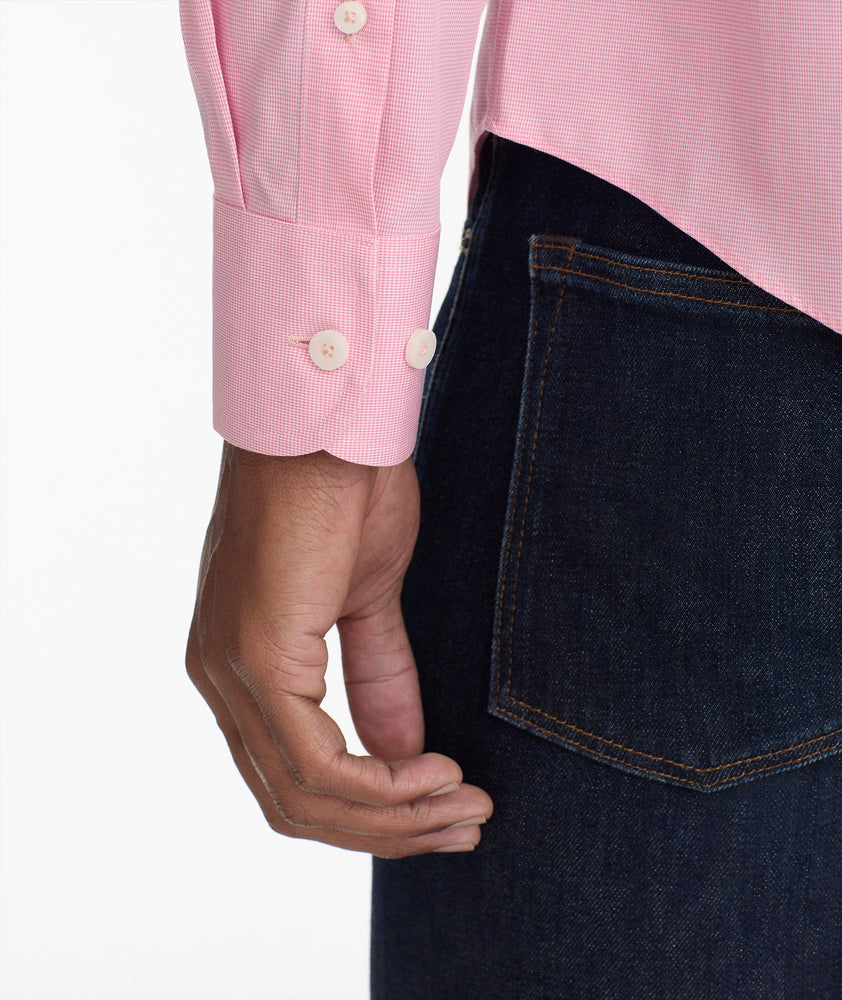 Model is wearing UNTUCKit cadetto wrinkle-free gingham shirt is berry.