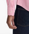 Model is wearing UNTUCKit cadetto wrinkle-free gingham shirt is berry.