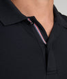 Model is wearing UNTUCKit Wrinkle-Free Damaschino Polo in black.