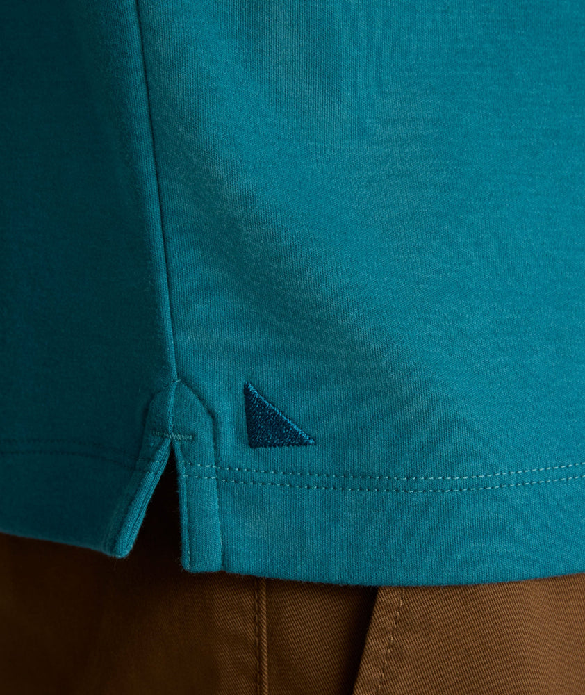 Model is wearing UNTUCKit Long Sleeve Damaschino in Dragonfly Teal.