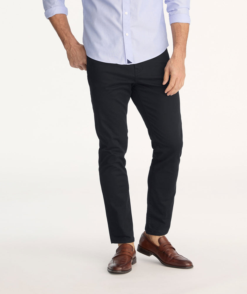 Model is wearing 5-Pocket Chino Pants in black.