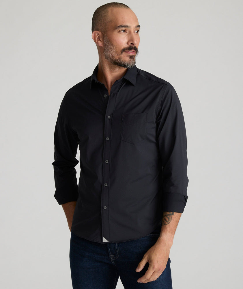 Model is wearing UNTUCKit gironde shirt in black.
