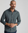 Model is wearing UNTUCKit girone performance shirt in urban chic.