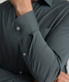 Model is wearing UNTUCKit girone performance shirt in urban chic.