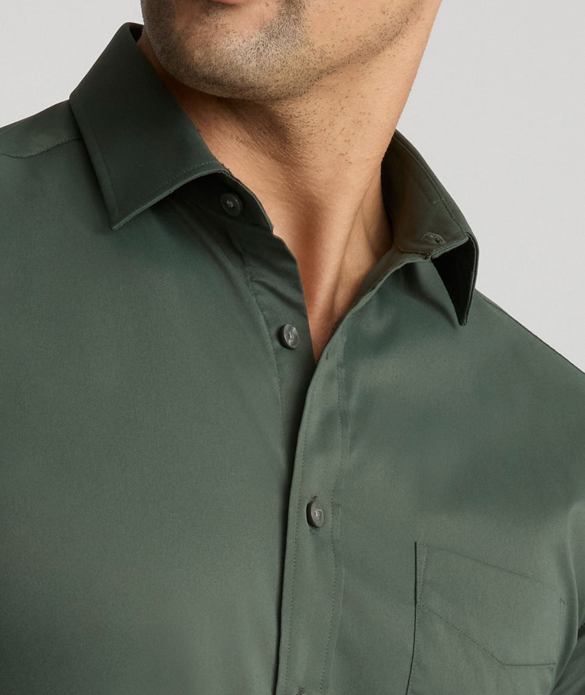 Model is wearing UNTUCKit Gironde performance shirt in Kombu green.