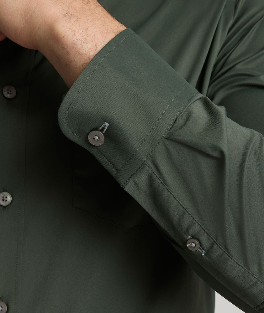 Model is wearing UNTUCKit Gironde performance shirt in Kombu green.