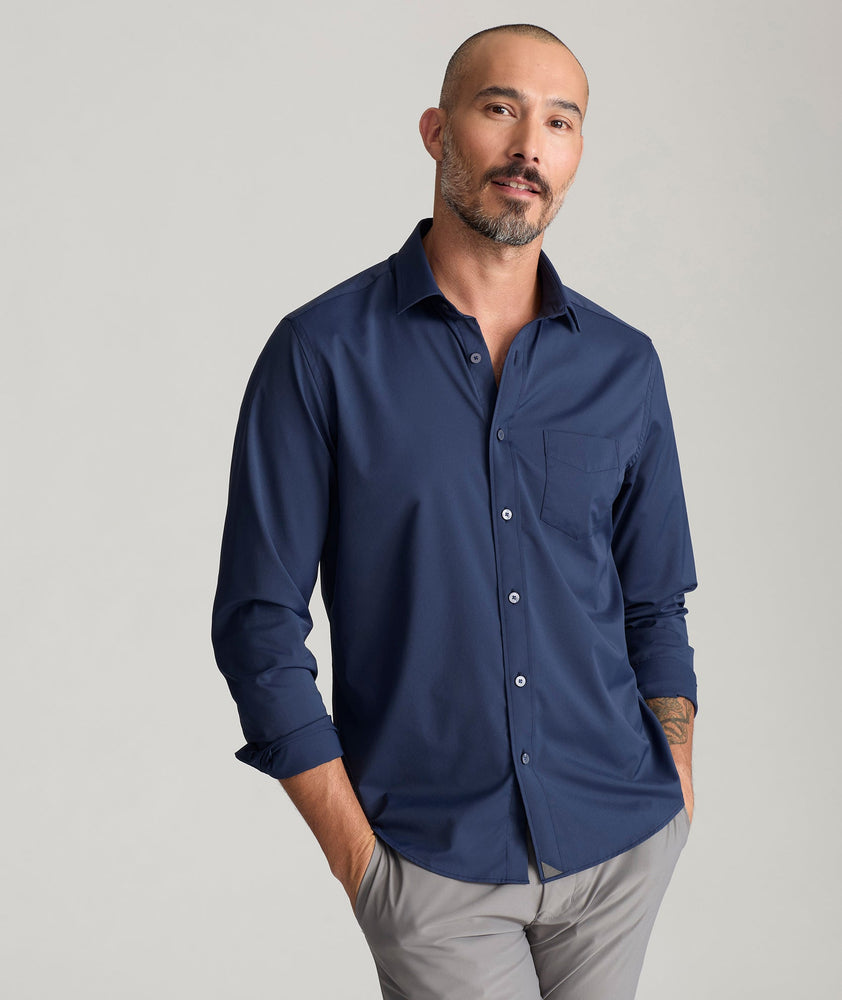 Model is wearing UNTUCKit Gironde in navy.