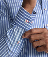 Model is wearing UNTUCKit Roy wrinkle-free shirt in blue.