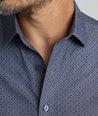 Model is wearing UNTUCKit Smithson wrinkle-free shirt in gray.