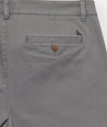 Model is wearing UNTUCKit Classic Chino Pants in Charcoal.