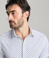 Model is wearing UNTUCKit Tidwell performance shirt.