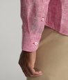 Model is wearing UNTUCKit Vin Santo in jalapeno red.