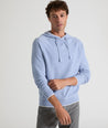 Model is wearing UNTUCKit Walcott cotton hoodie in heather blue.