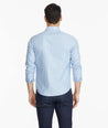 Model wearing a Blue Wrinkle-Free Blakeslee Shirt