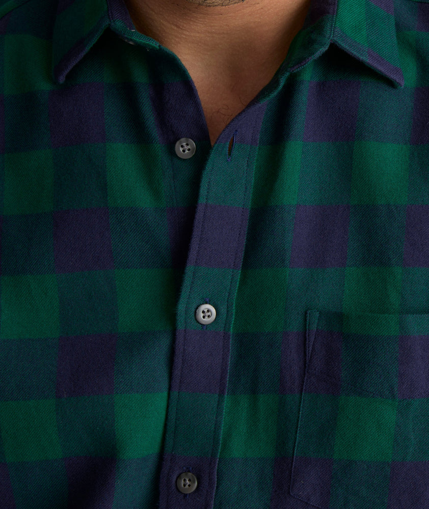 Model is wearing UNTUCKit Flannel Barrelstone Shirt in Blue & Green Check.