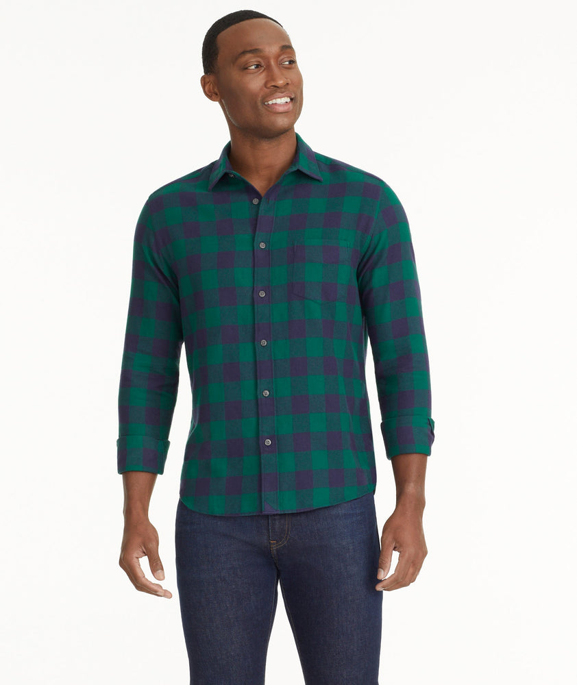 Model is wearing UNTUCKit Flannel Barrelstone Shirt in Blue & Green Check.