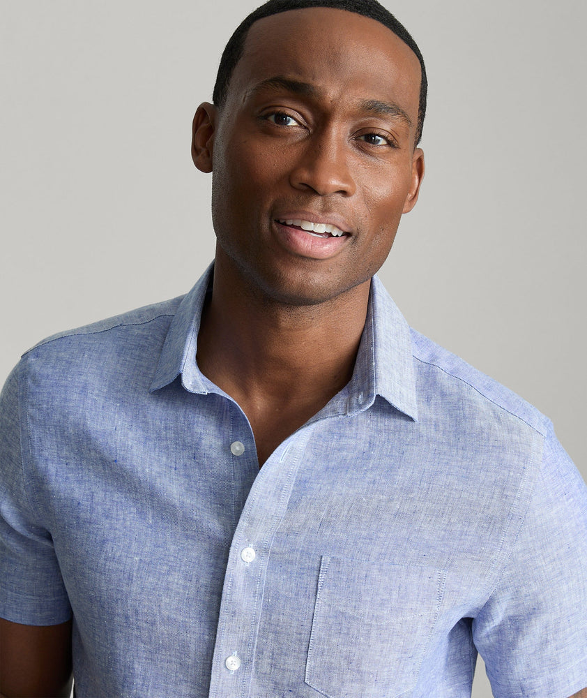 Model wearing an UNTUCKit Blue Wrinkle-Resistant Linen Short Sleeve Cameron Shirt.