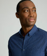 Model is wearing UNTUCKit Wrinkle-Free Cascadar Shirt in navy. 