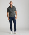 Model is wearing UNTUCKit Chancellor pants in navy. 