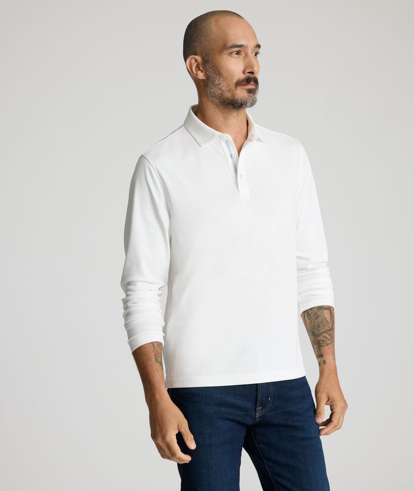 Model is wearing UNTUCKit Damaschino long sleeve in snow white. 