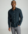 Model is wearing UNTUCKit Wrinkle-Free Grant Shirt in  Green & Navy Tartan.