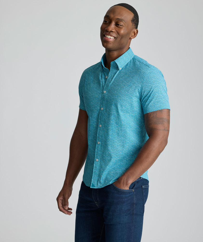 Model is wearing UNTUKit Halloway performance shirt in teal. 