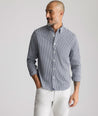 Model is wearing UNTUCKit CottonTek Harland Shirt in navy. 