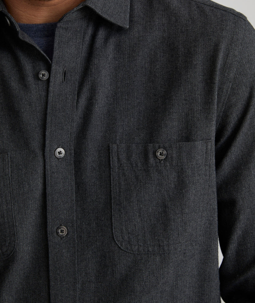 Model is wearing UNTUCKit Flannel Hemsworth Shirt in Deep Gray Herringbone.