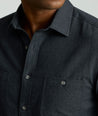 Model is wearing UNTUCKit Flannel Hemsworth Shirt in Deep Gray Herringbone.