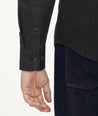 Model is wearing UNTUCKit Flannel Hemsworth Shirt in Deep Gray Herringbone.