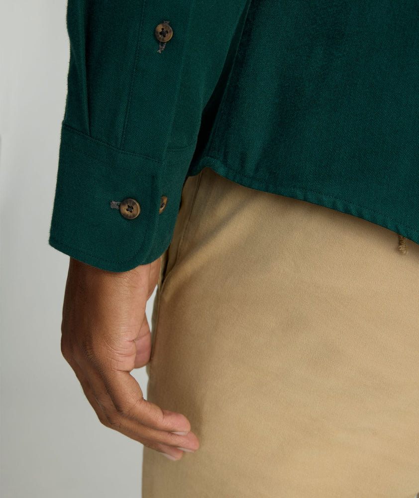 Model is wearing UNTUCKit Flannel Hemsworth Shirt in scarab. 