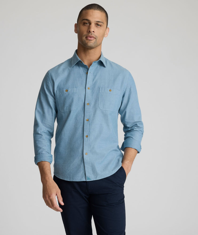 Model is wearing UNTUCKit Hemsworth in real teal.