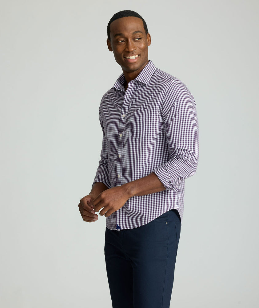 Model is wearing UNTUCKit Wrinkle-Free Lawrence Shirt in blackberry. 