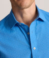 Model is wearing UNTUCKit Performance Short-Sleeve Livingston Shirt in Blue Shark Fin Print.