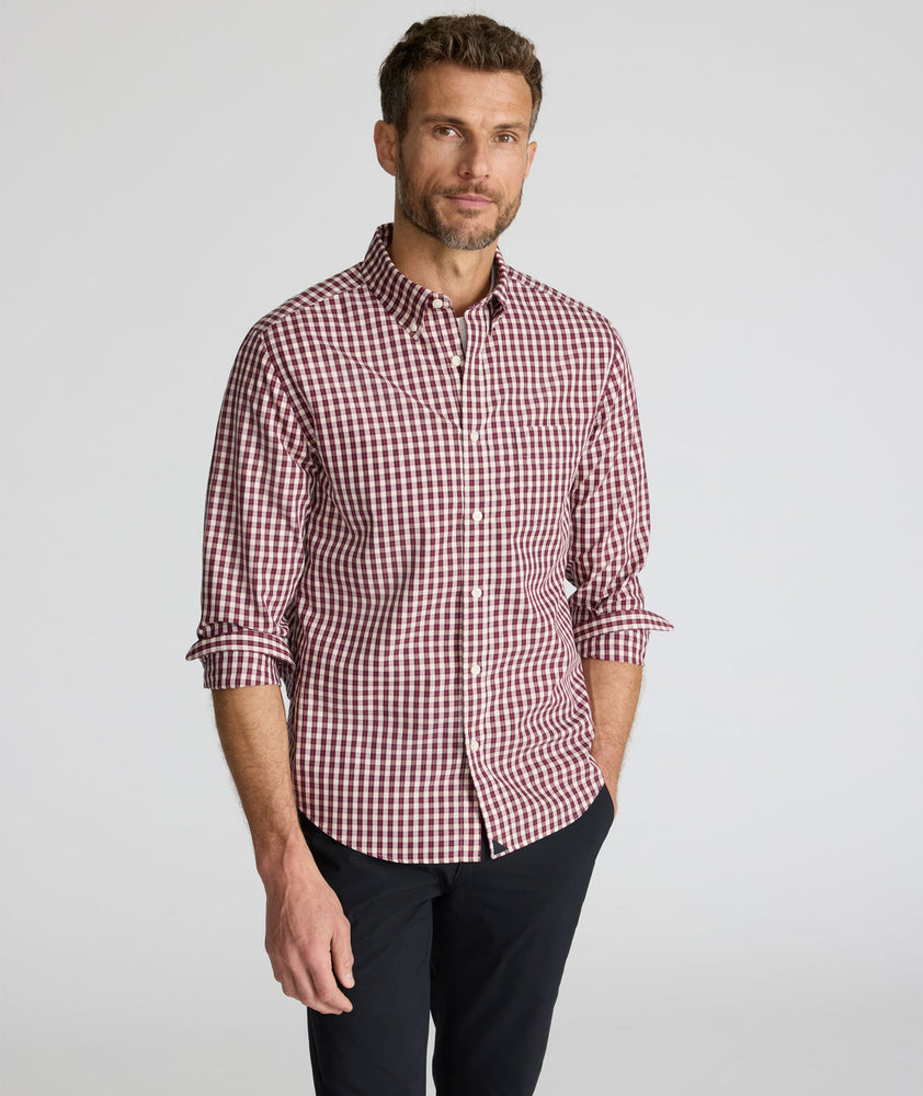Model is wearing UNTUCKit Wrinkle-Free Marchand Shirt in Black, Red, & White Plaid.
