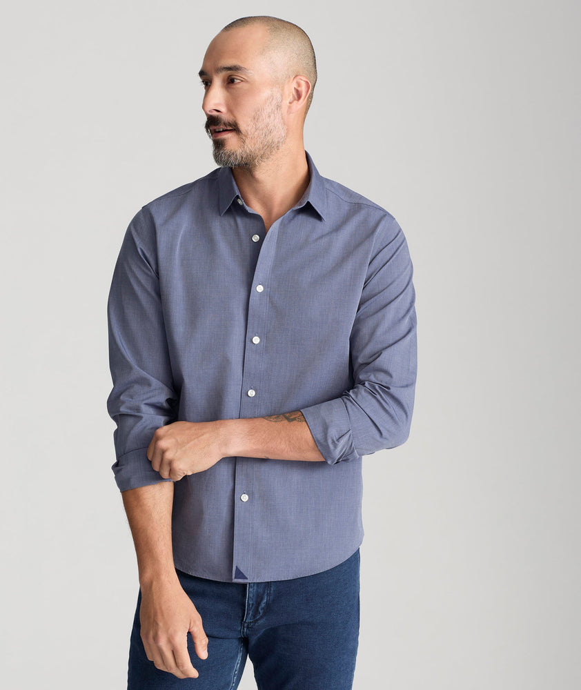 Model is wearing UNTUCKit wrinkle free orville shirt. 