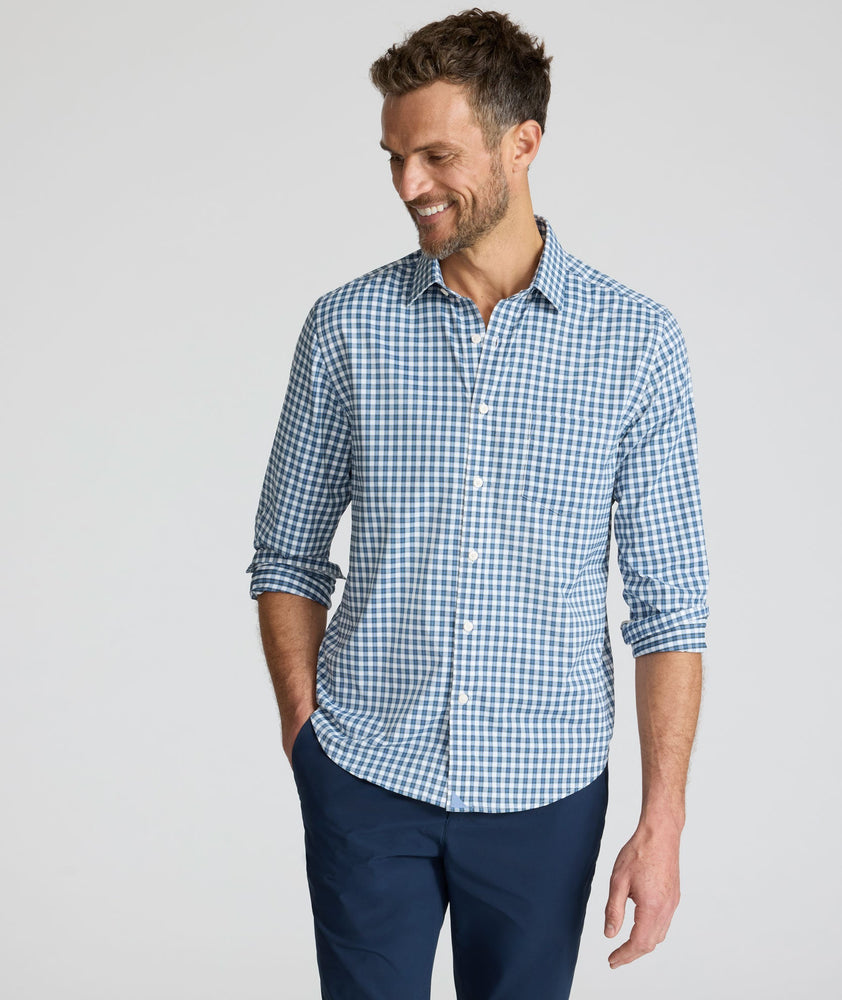 Model is wearing UNTUCKit Performance Renshaw Shirt in Green & White Plaid.