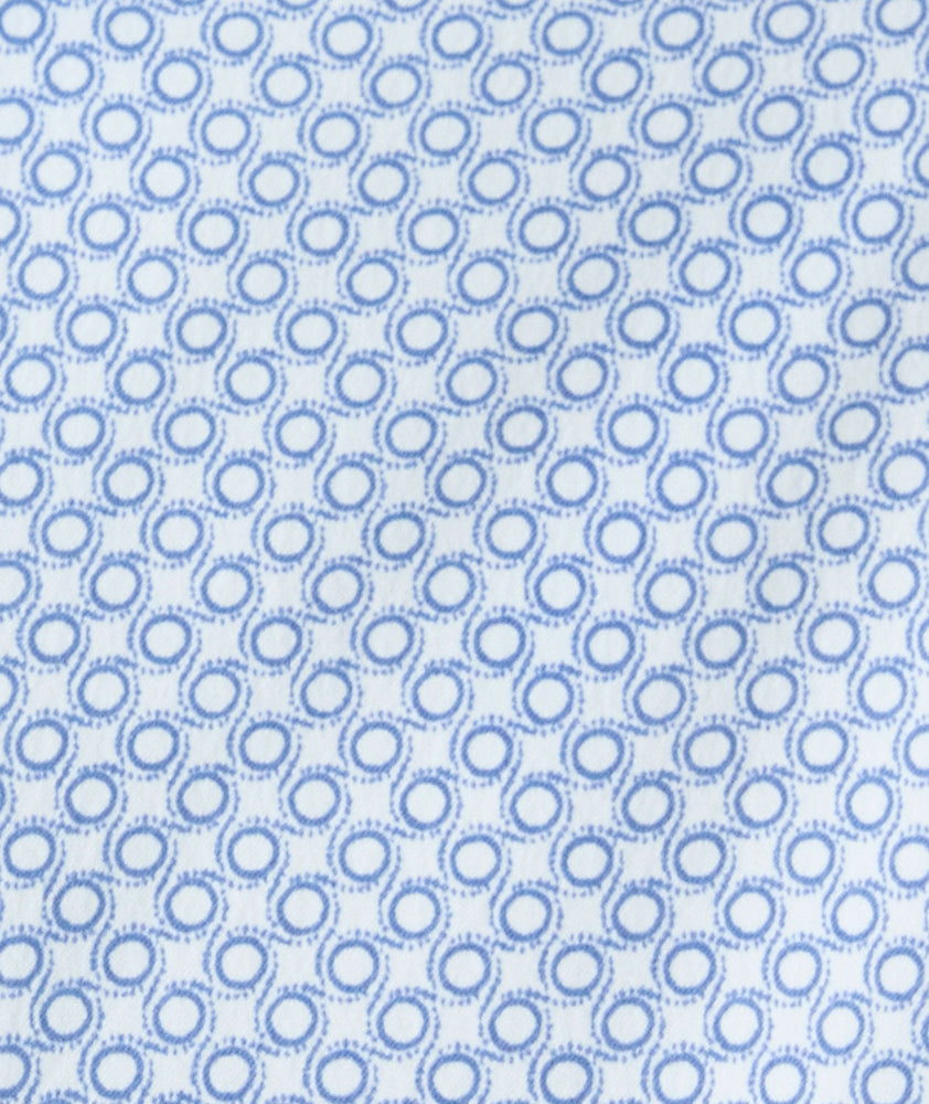 Model is wearing UNTUCKit Performance Shirt with Pocket in Blue Circle Print.