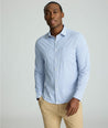 Model is wearing UNTUCKit Performance Shirt with Pocket in Blue Circle Print.