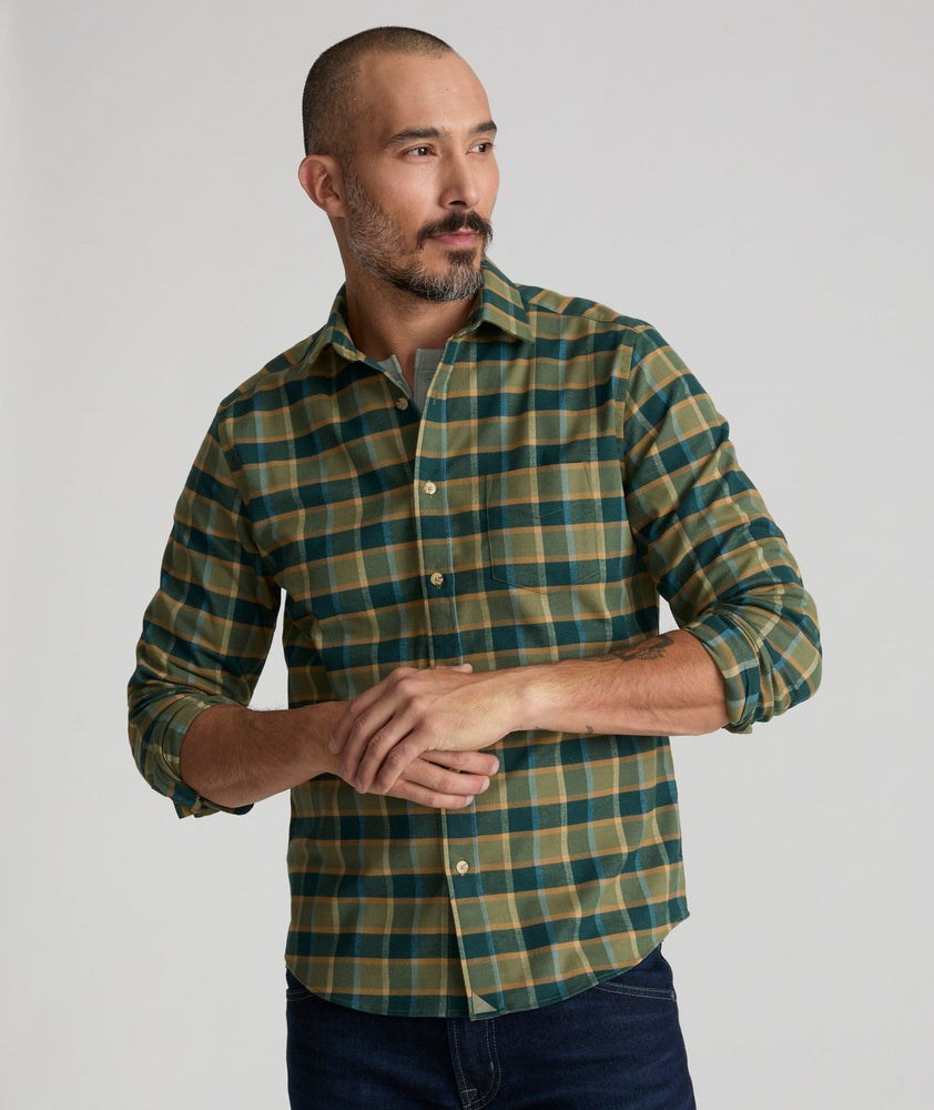 Model is wearing UNTUCKit Ryan performance shirt in green. 