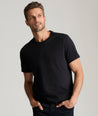 Model is wearing UNTUCKit Saxum ultra soft tee in black. 