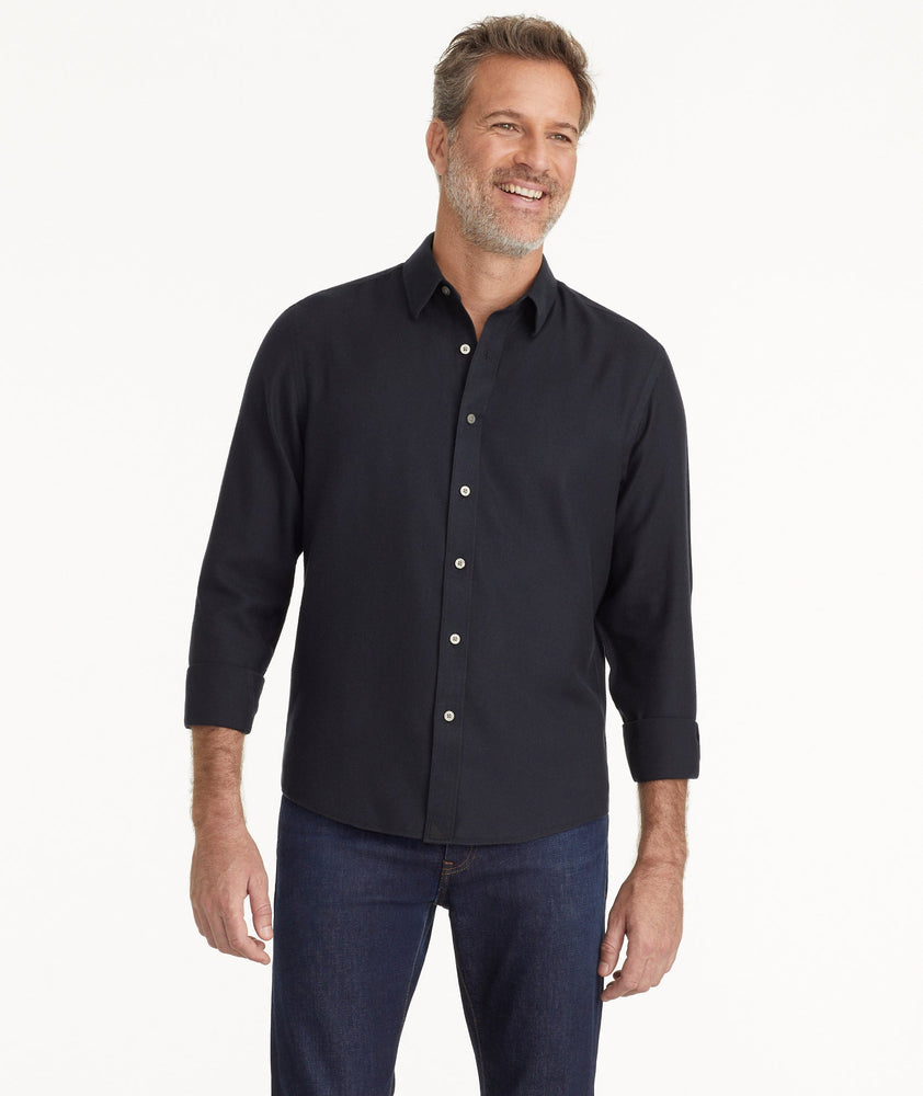 Model is wearing UNTUCKit Wrinkle-Free Veneto Shirt in black.