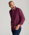 Model is wearing UNTUCKIt Wrinkle-Free Veneto Shirt in dark berry.