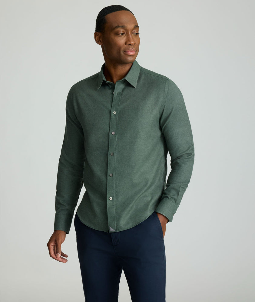 Model is wearing UNTUCKIt Wrinkle-Free Veneto Shirt in Deep Forest.