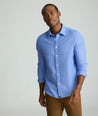 Model is wearing UNTUCKit Wrinkle-Free Veneto Shirt in light blue.
