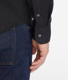 Model wearing an UNTUCKit Black Wrinkle-Resistant Linen Vin Santo Shirt